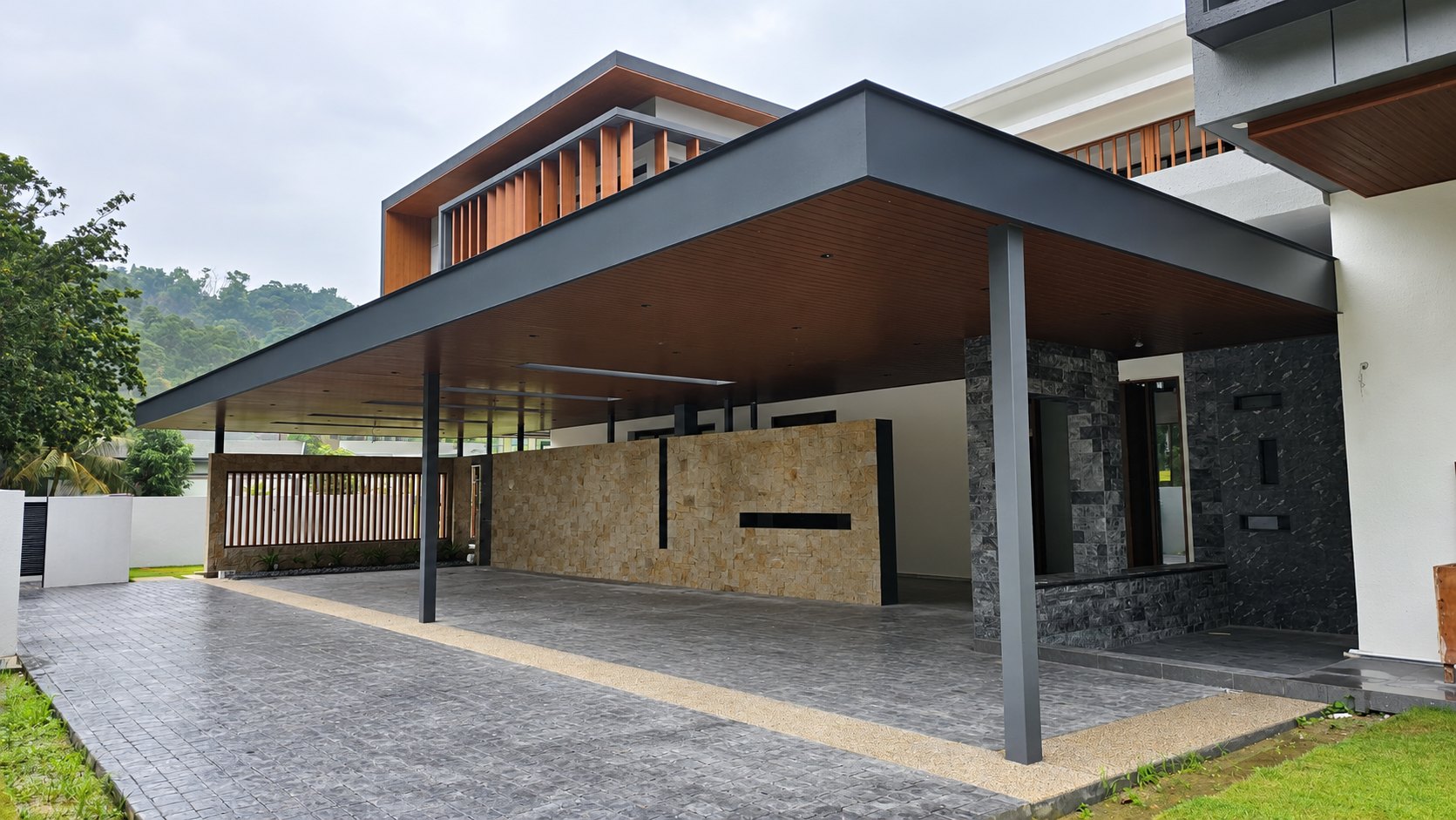 Contemporary residential awning with dark beams and warm timber ceiling in Kota Damansara