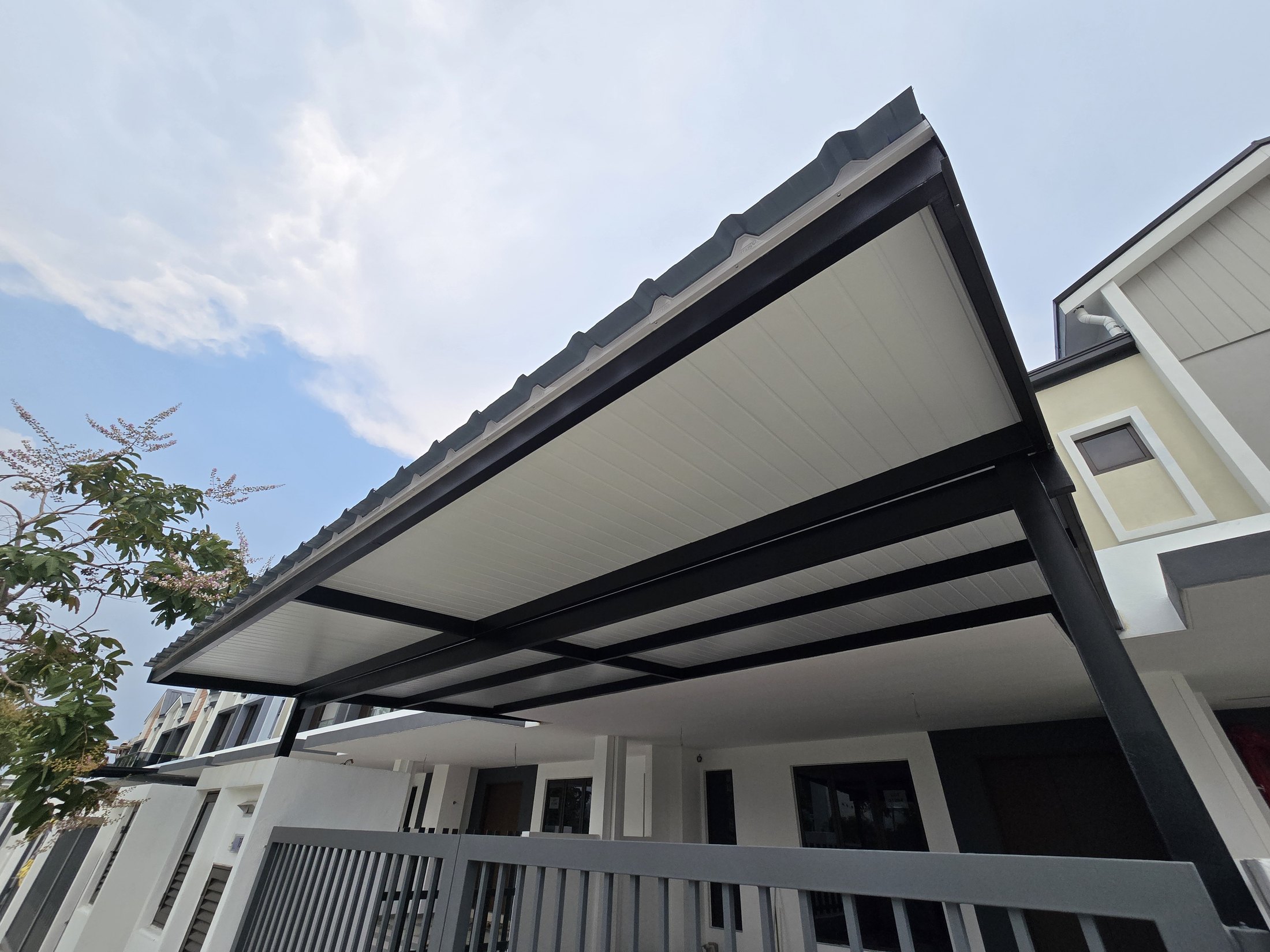 PU metal roofing awning with white ceiling panels and dark steel frame